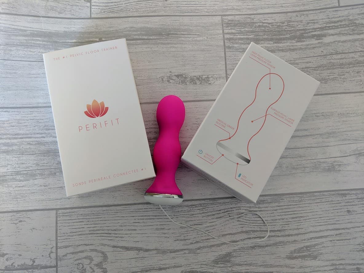 bright pink silicone perifit to insert into vagina for kegel exercises