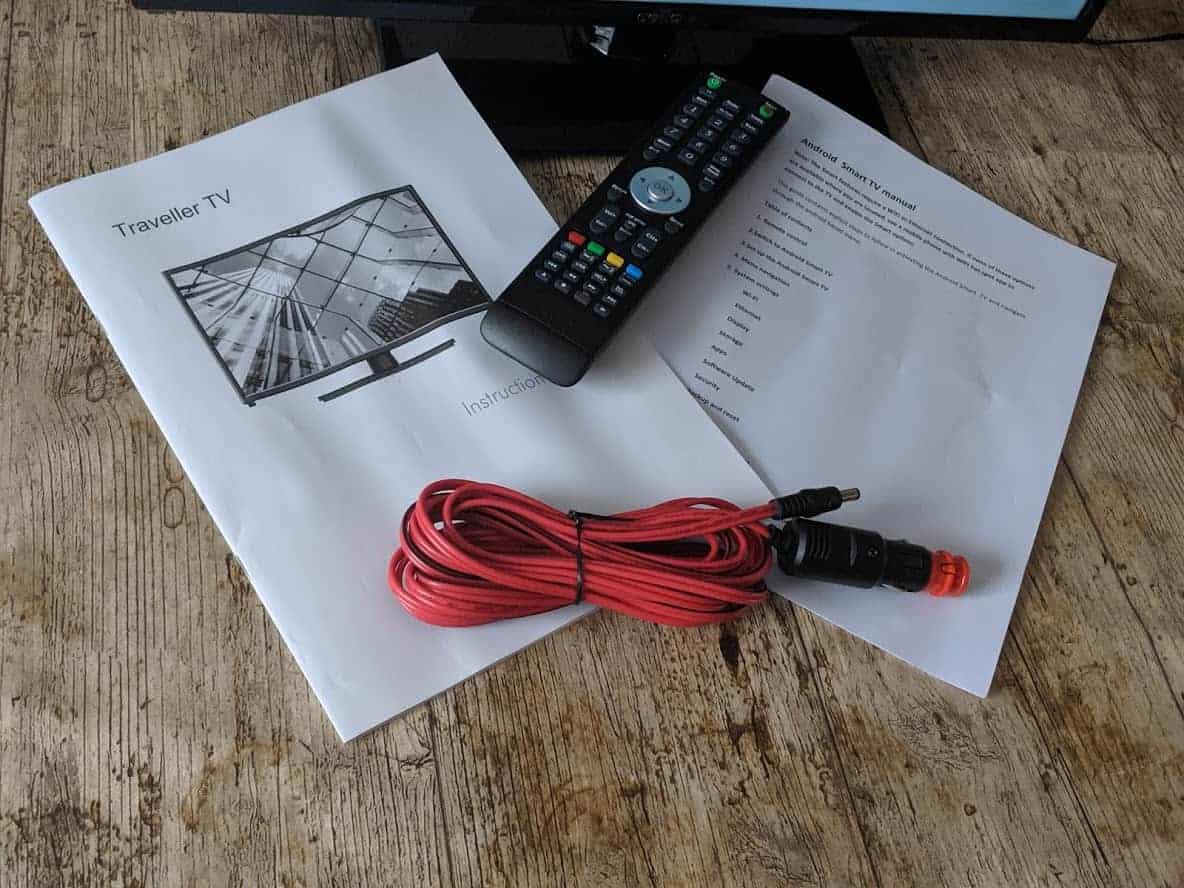 instruction booklets, tv remote control and cable