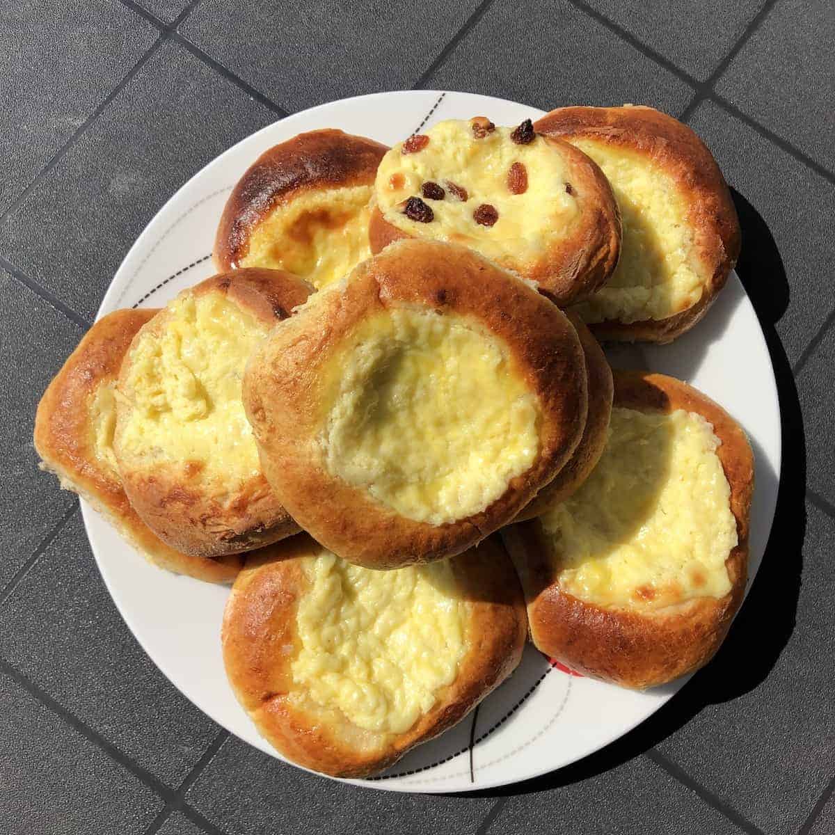 Polish sweet cheese buns on a white plate.