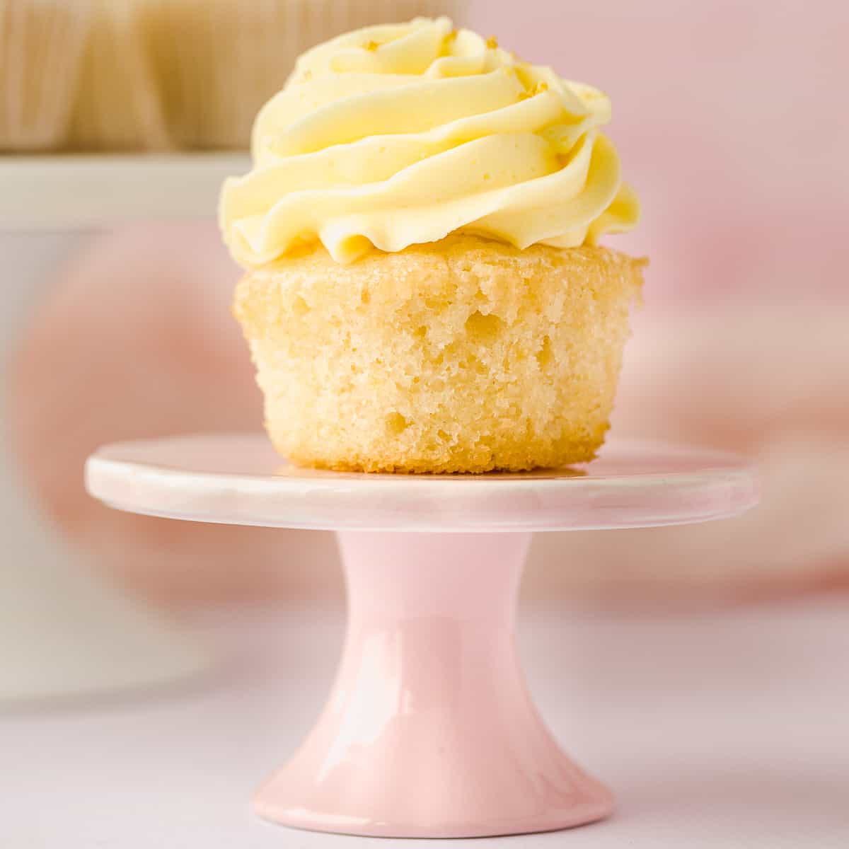 A lemon flavoured cupcake with a swirl of lemon buttercream icing.