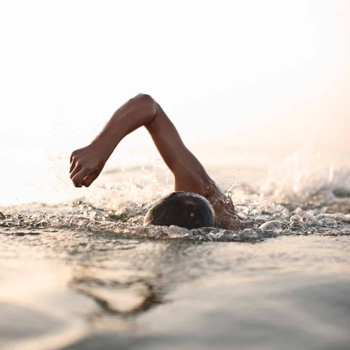 Person open water swimming