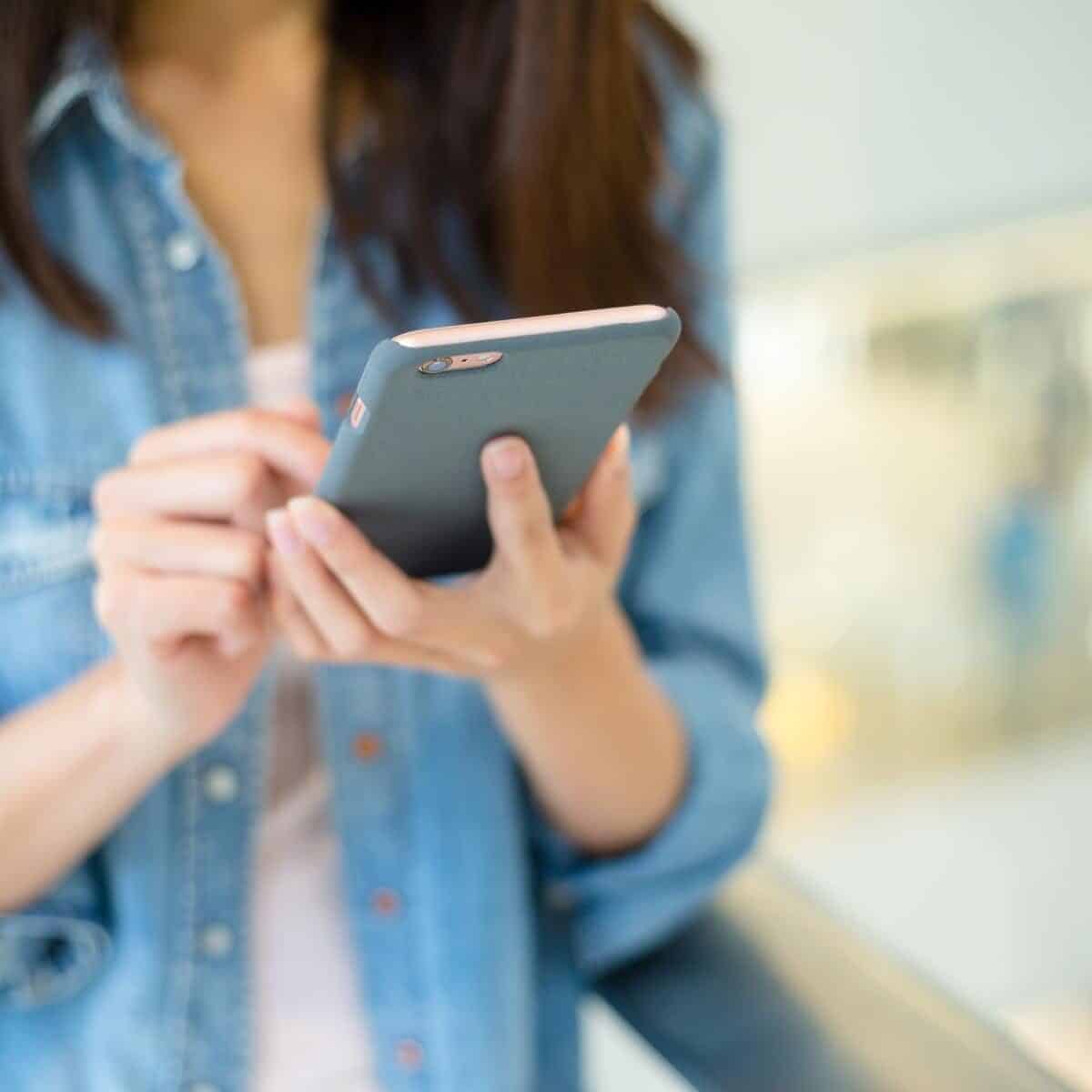 lady holding a mobile phone
