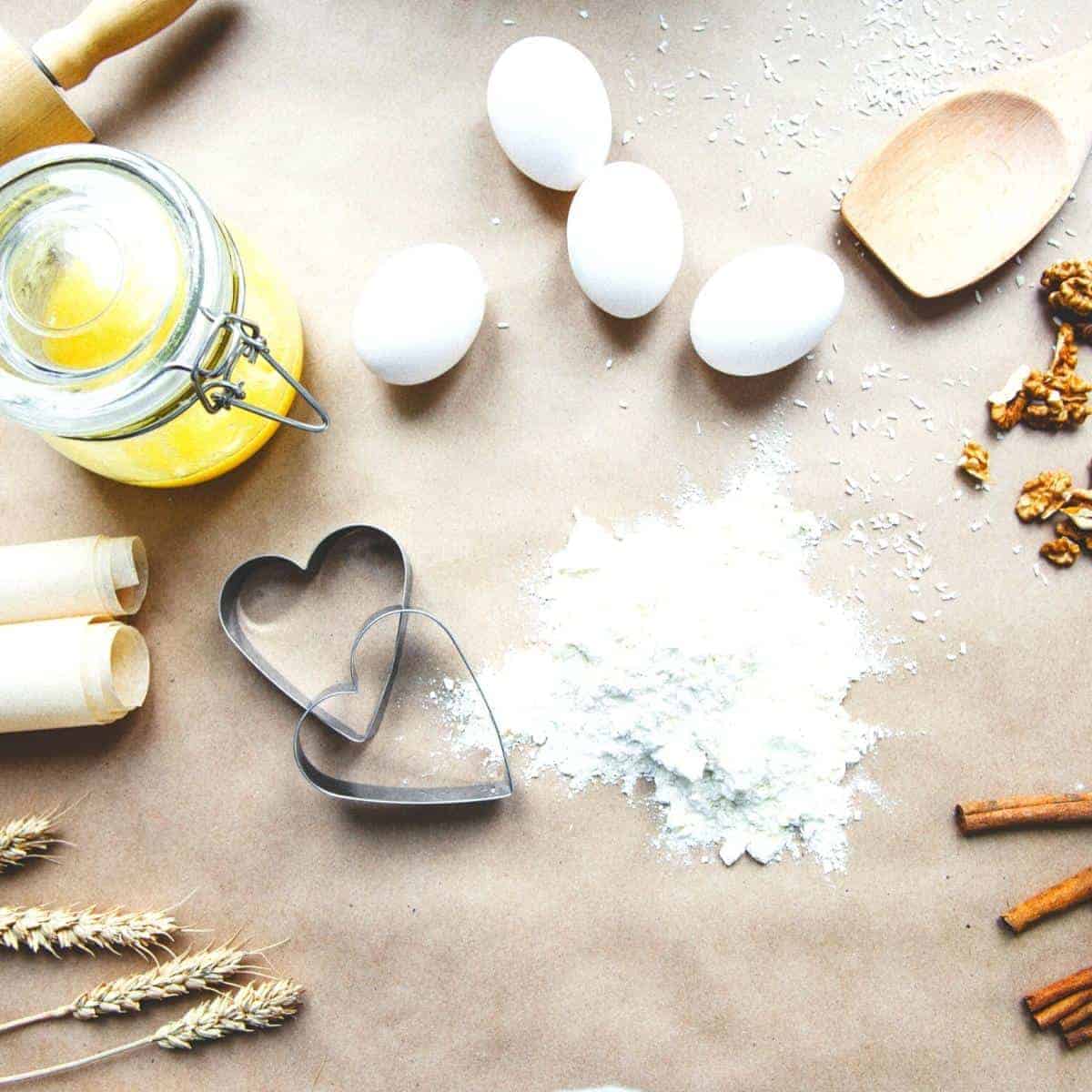 baking equipment with eggs flour and butter in a mason jar