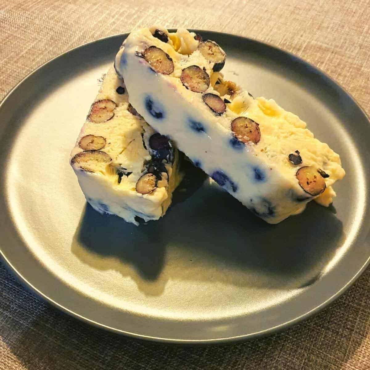 blueberry and vanilla semifreddo slices on a plate