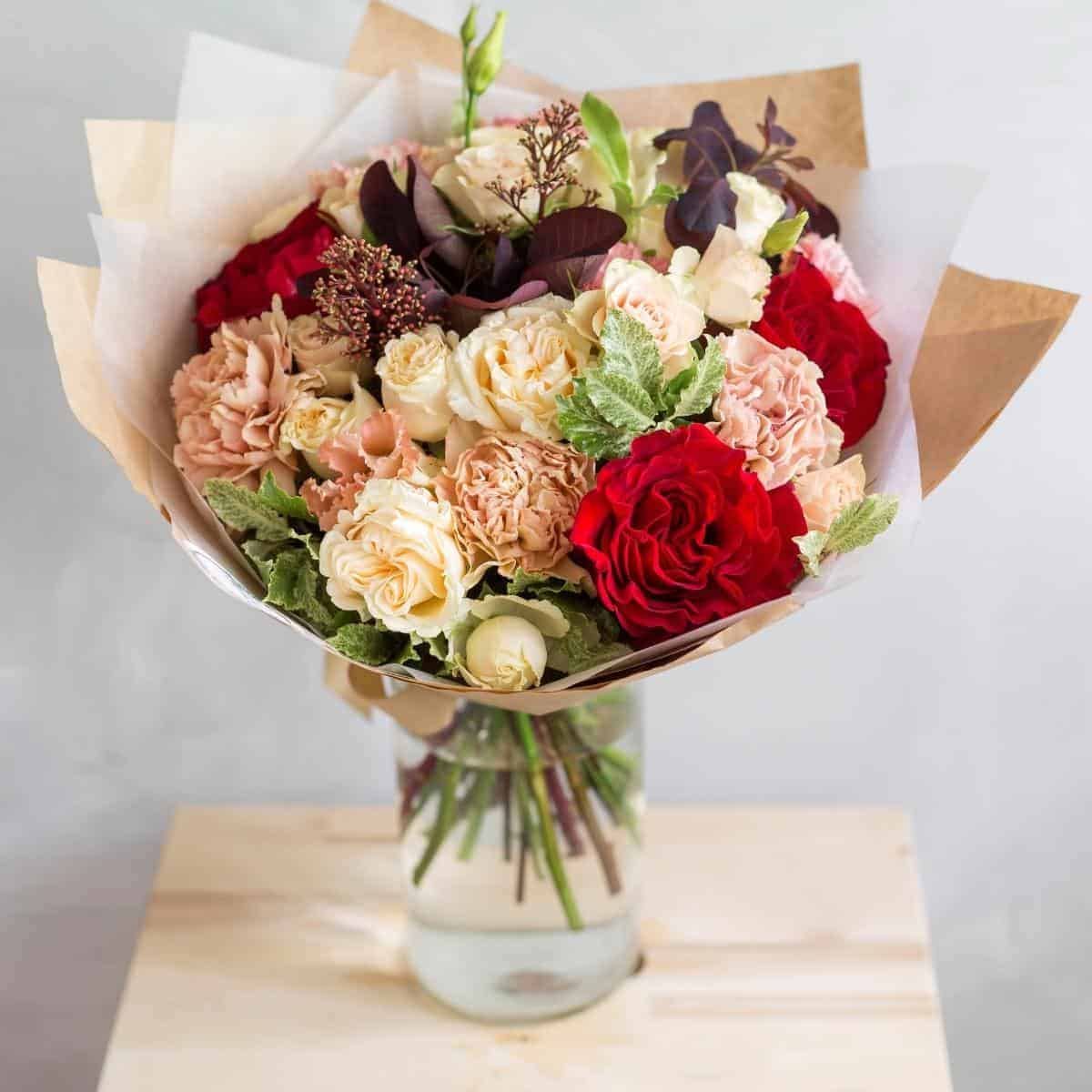 Beautiful bouquet of flowers on a wooden table