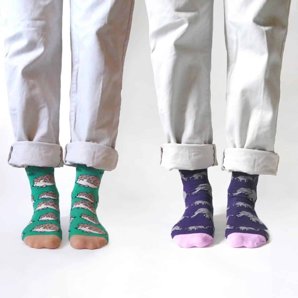 two pairs of legs wearing colourful bamboo socks