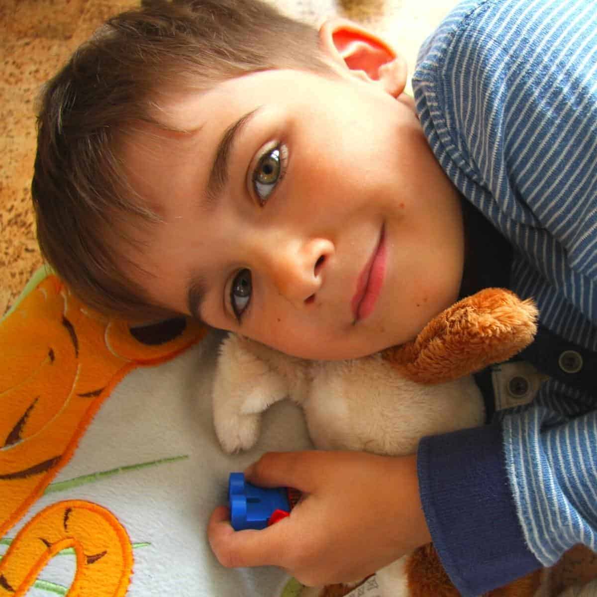 boy lying on a blanket
