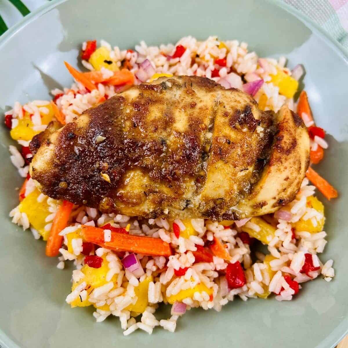 Caribbean rice topped with a jerk chicken breast.