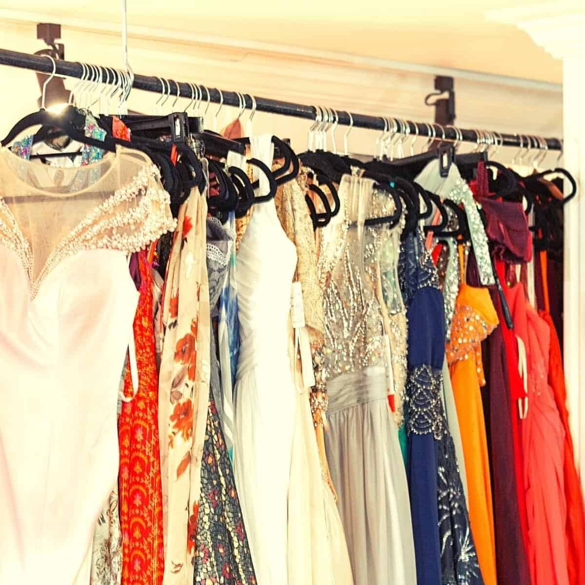 selection of dresses on a rail in all different colours and styles.