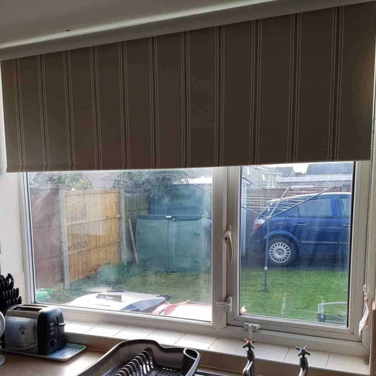 kitchen blind half up showing garden