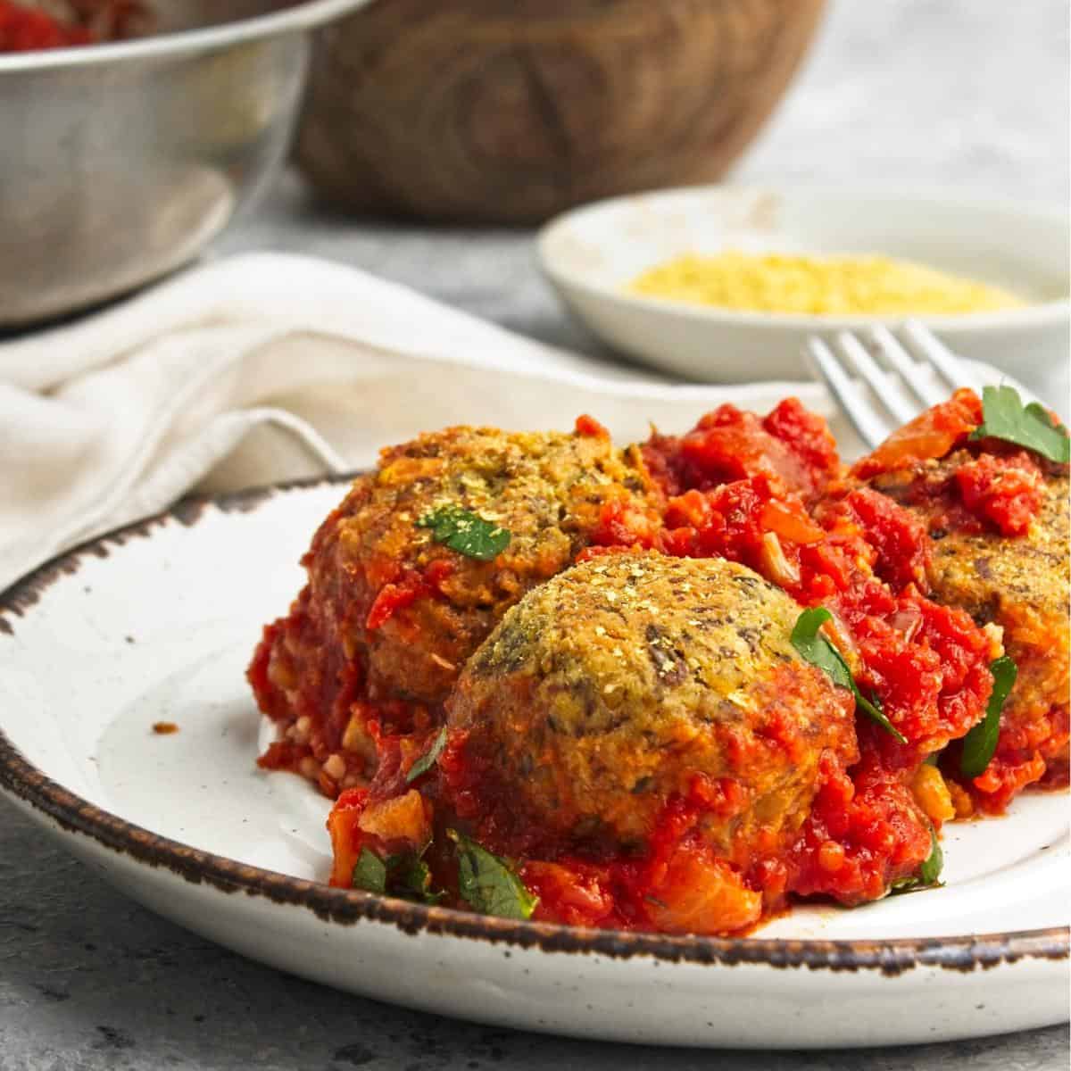 a portion of vegan meatballs in tomato sauce.