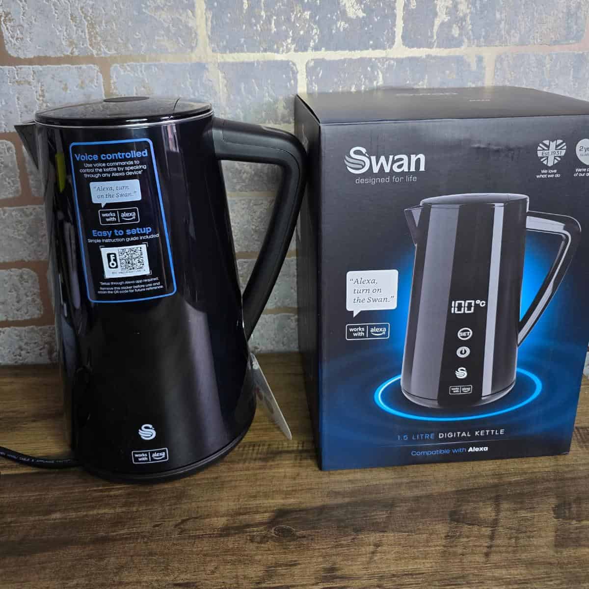 a black kettle next to a box