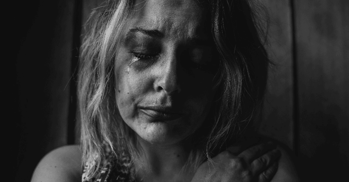 black and white photo of a woman crying