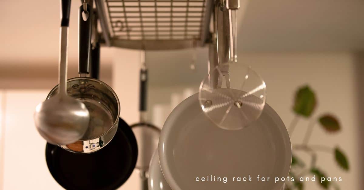 Pots and pans hanging from a ceiling rack