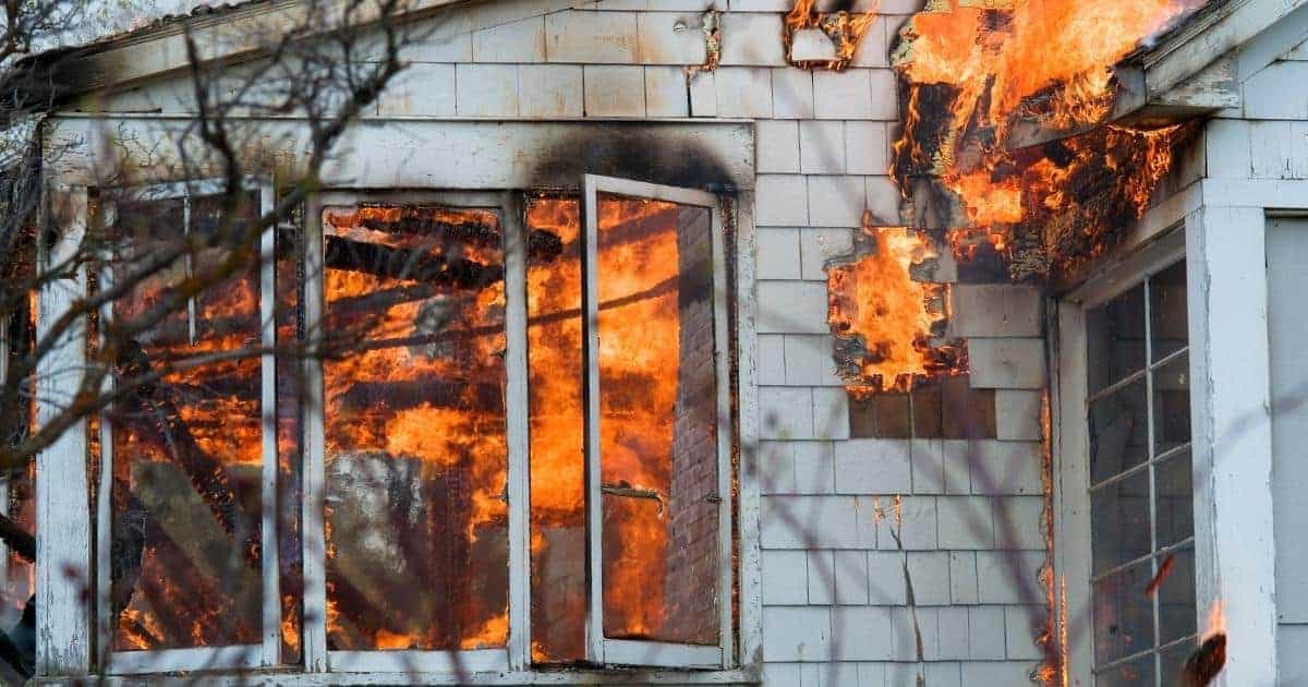 white house with flames shooting out the windows