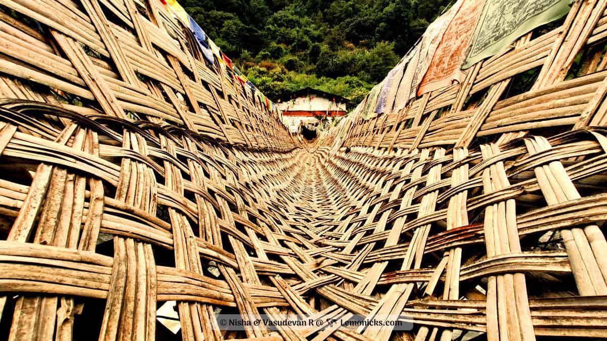 Chagzam bridge ancient engineering marvel in Tawang arunachal pradesh. The bridge is stayed using iron chains and covered by mat made of bamboo and cane