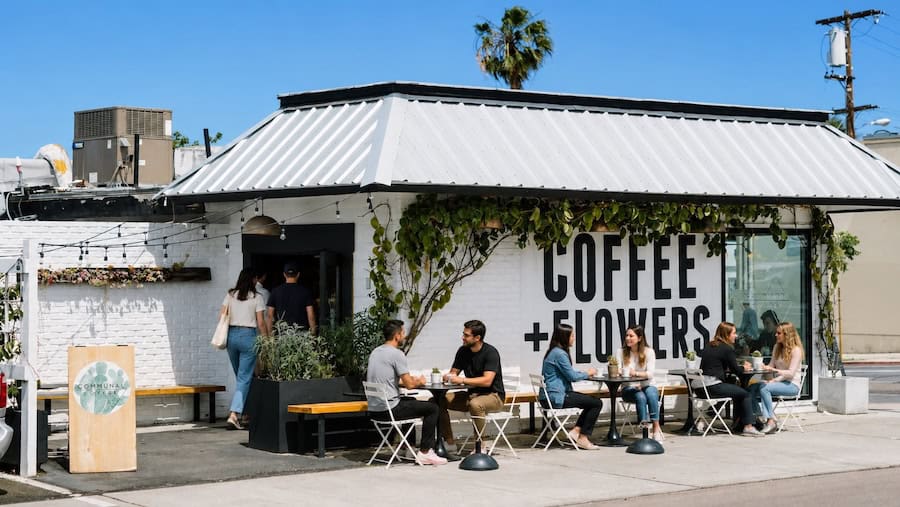 people sitting outside of communal coffee in north park san diego
