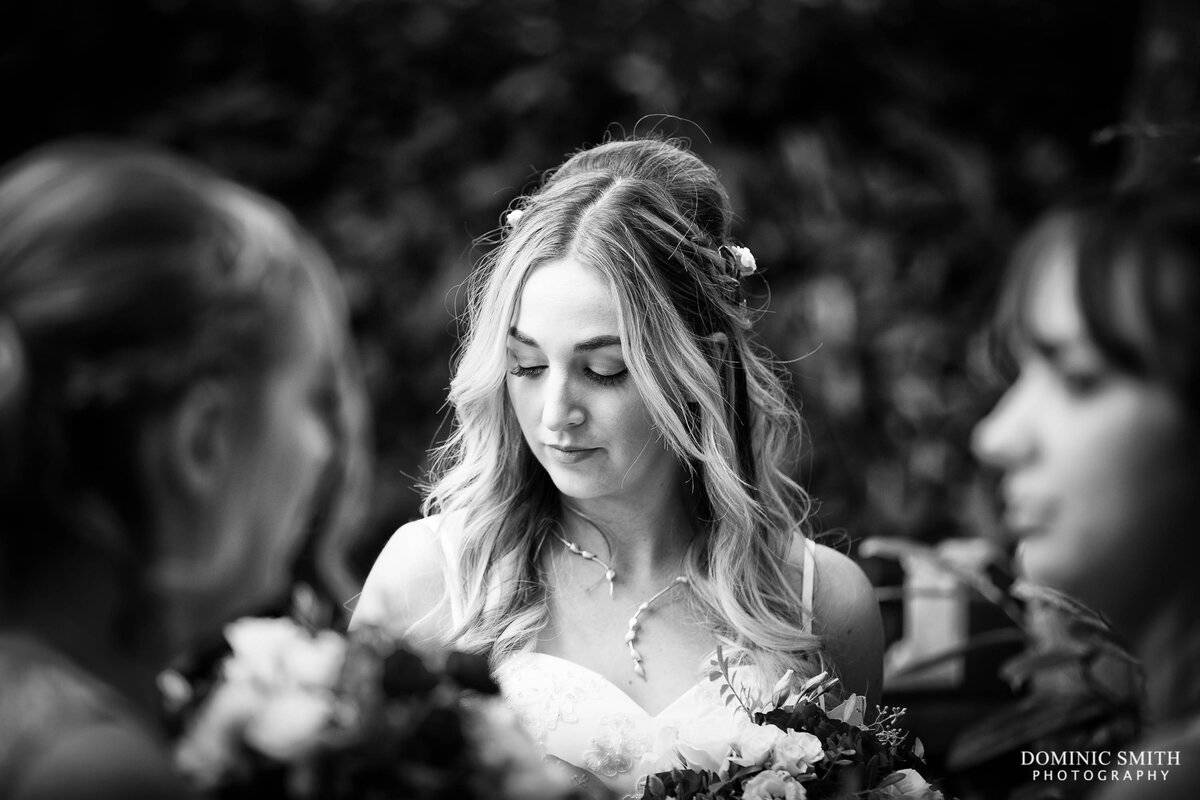 Bride waits at Nymans Gardens