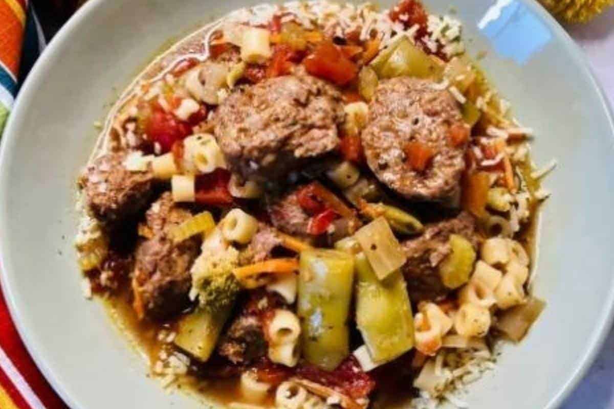 Italian meatball soup in white bowl