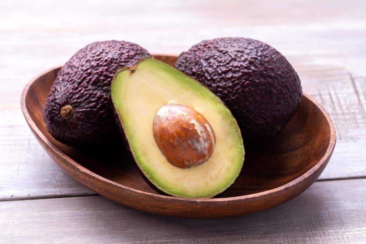 Avocadoes in a wooden bowl