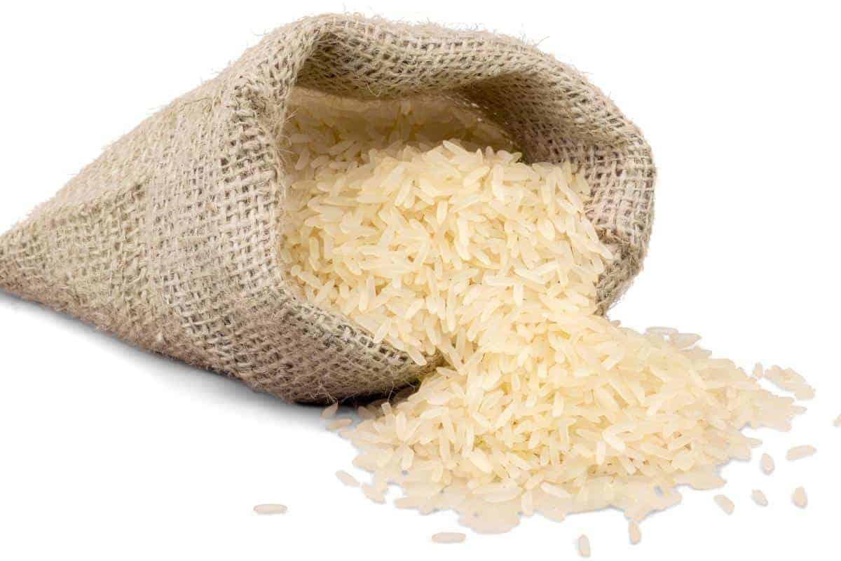 hessian bag of dry rice on a white table