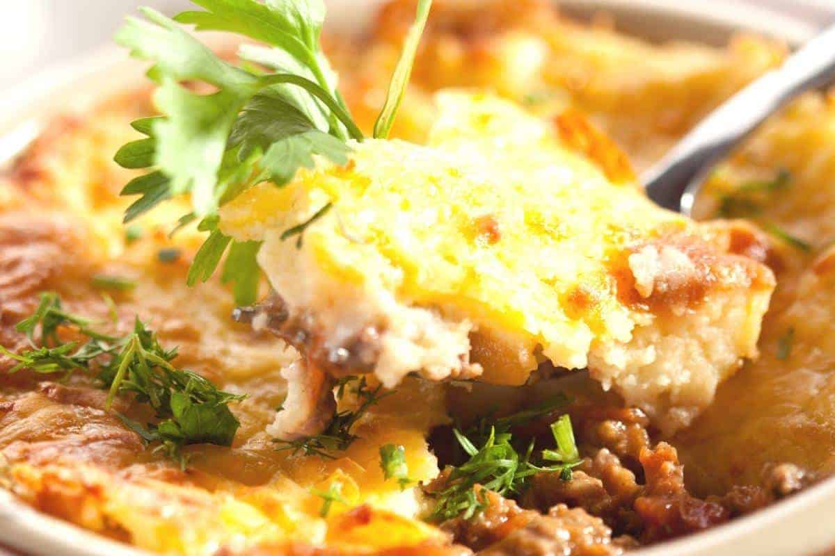 a close up of cottage pie on a fork