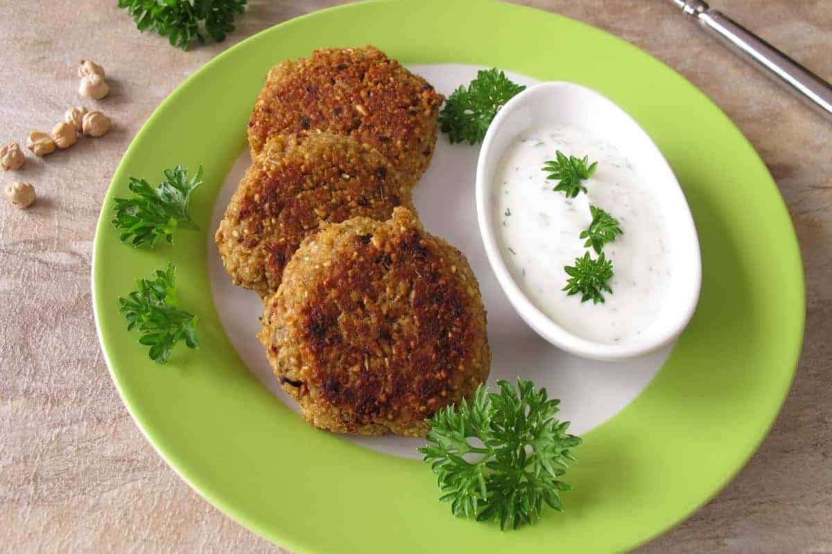 Falfel burgers on a green plate