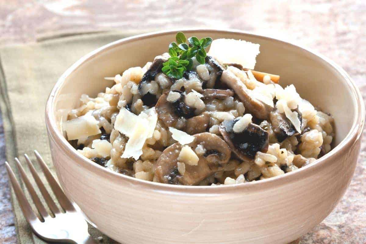 Garlic mushroom risotto in a beige bowl