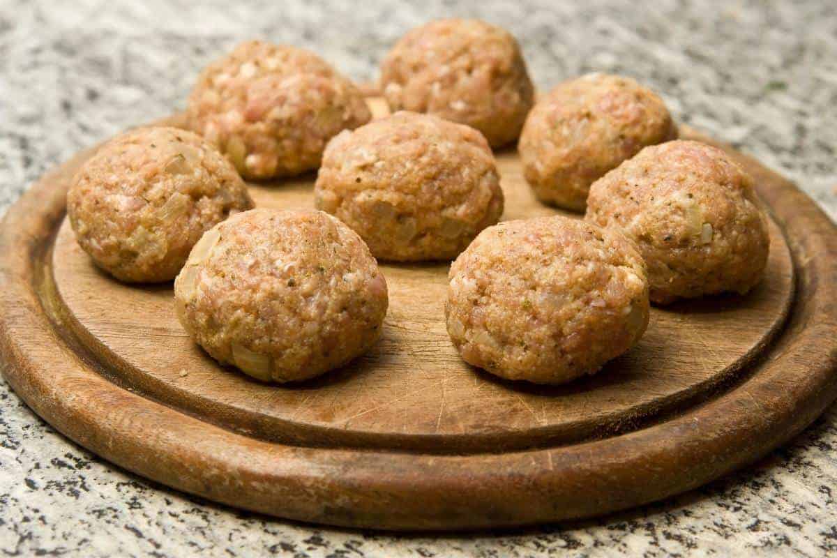 Burger balls on a wooden board.
