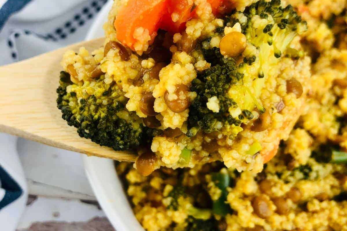 wooden spoon of vegetable couscous