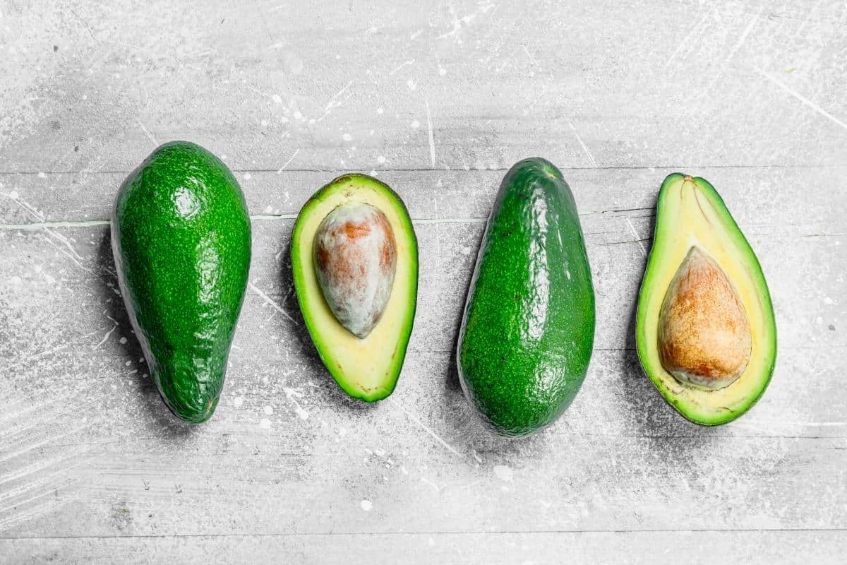 two avocadoes halved