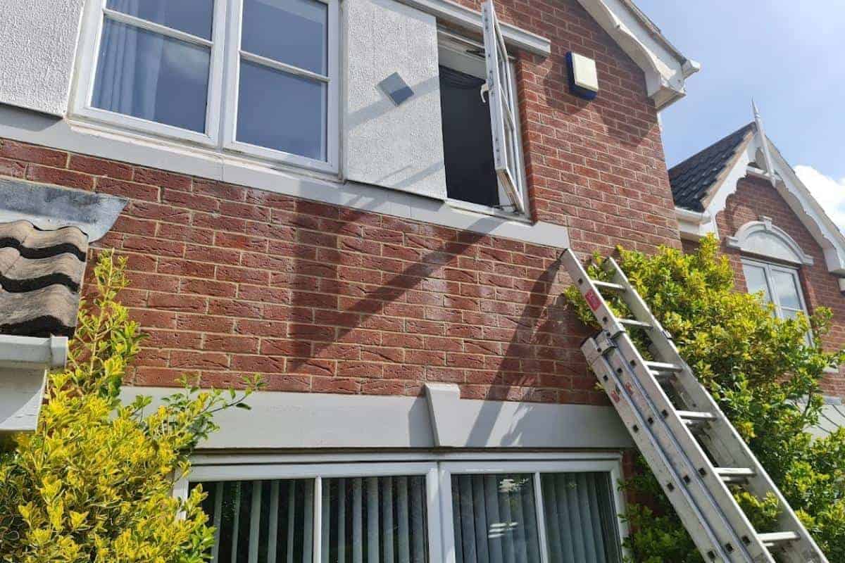 ladders against front of a house.