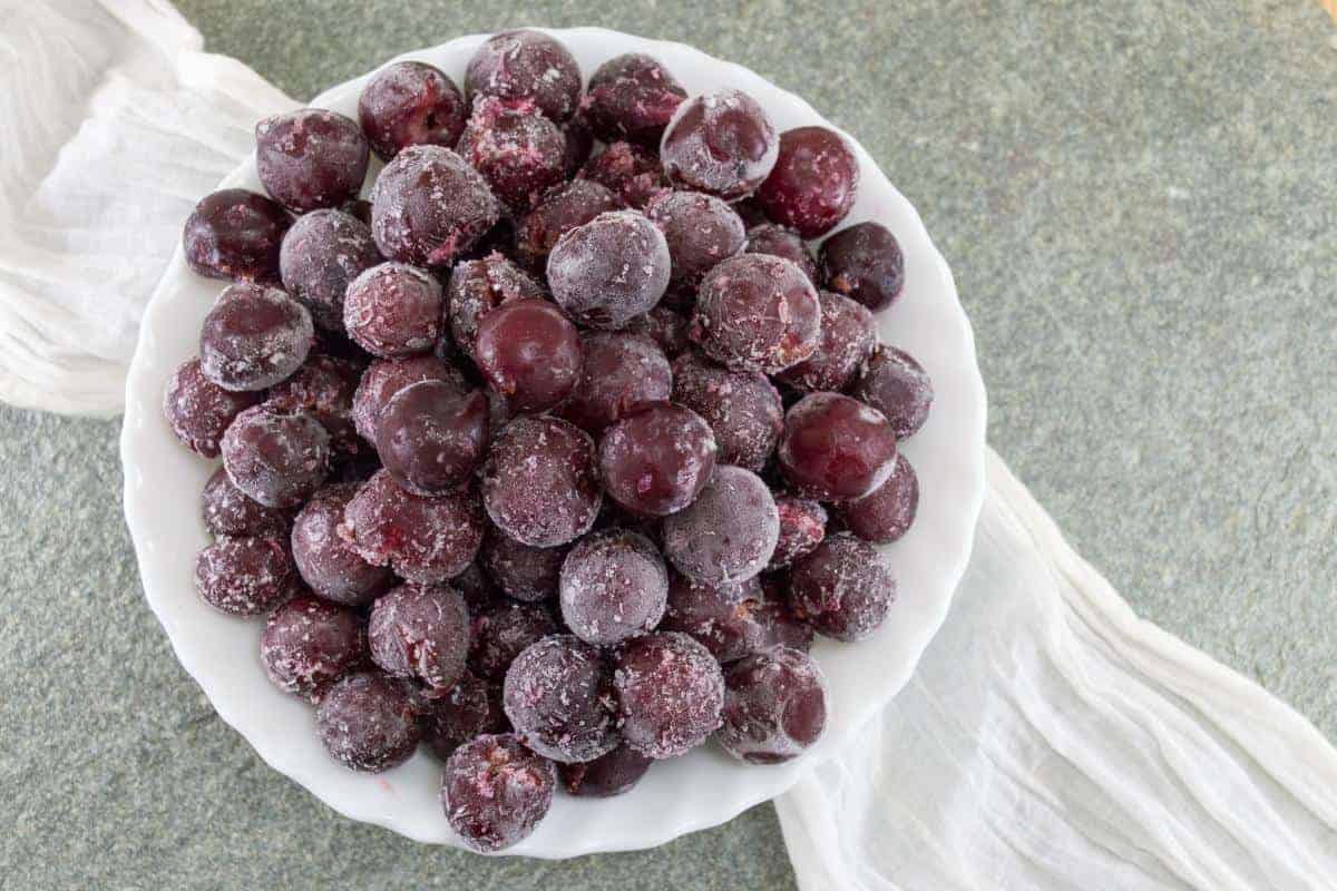 a bowl of frozen grapes