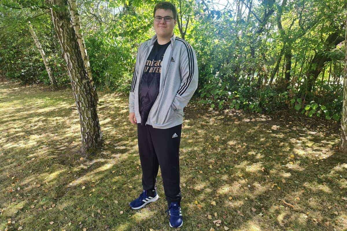 Teenage boy in warm autumn adidas clothes