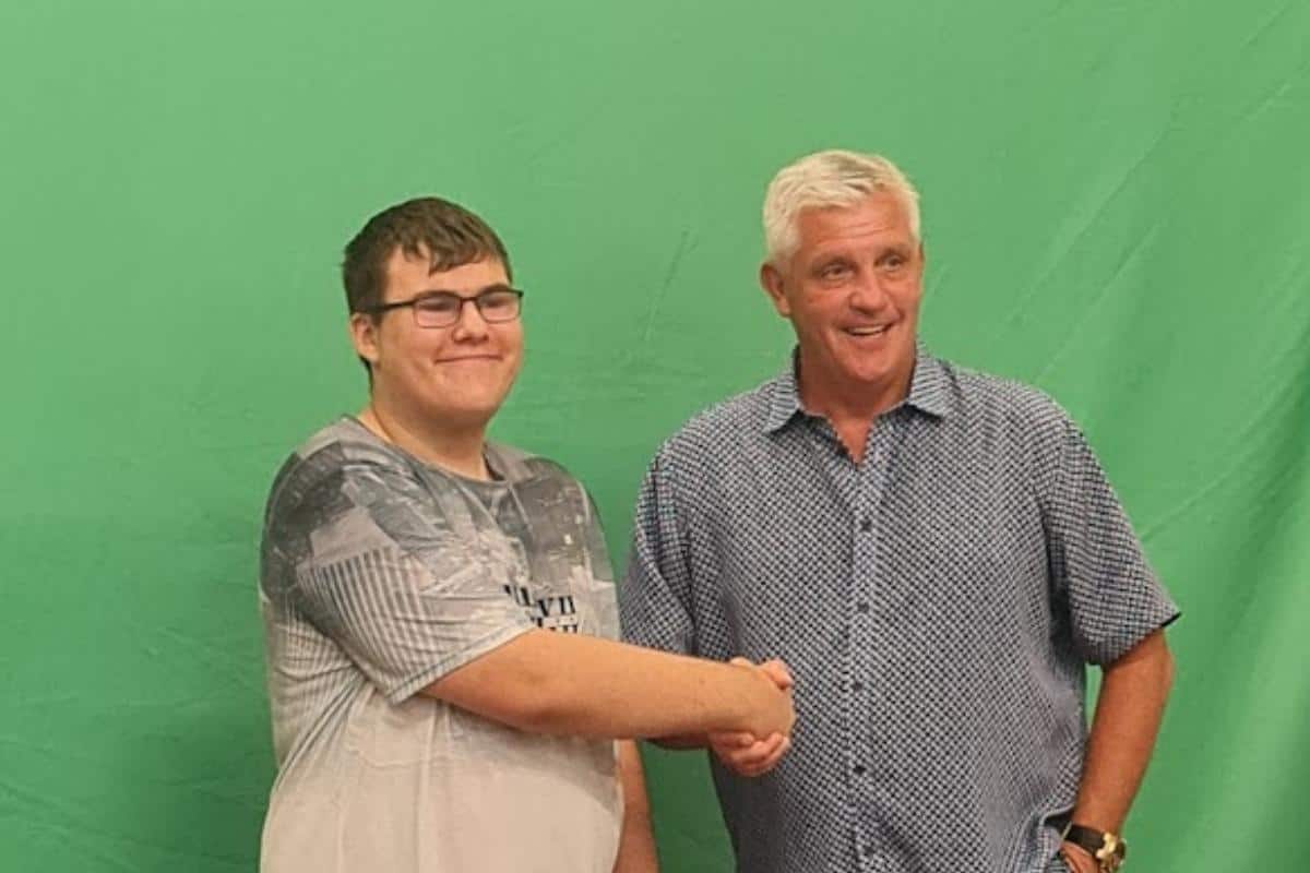 a man and boy shaking hands