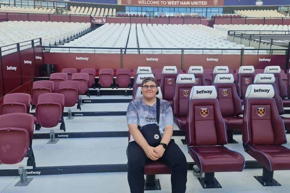 a man sitting in a stadium seat