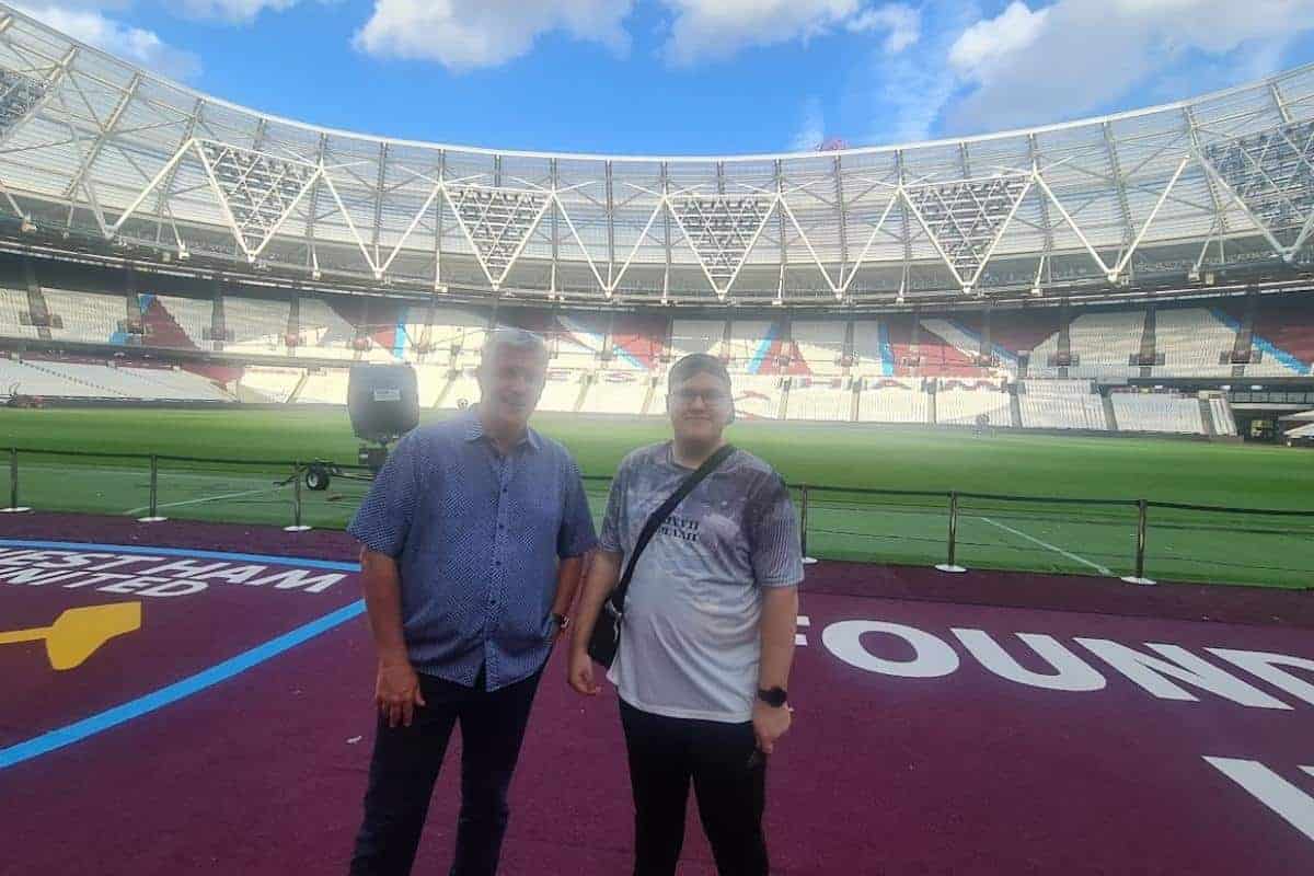 two men standing in a stadium