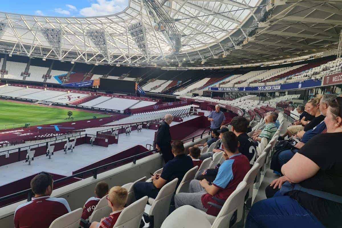 a group of people sitting in a stadium