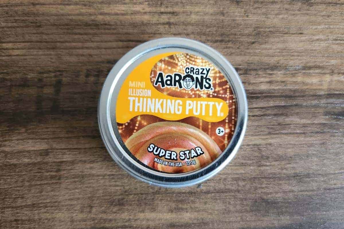 Small tin of thinking putty