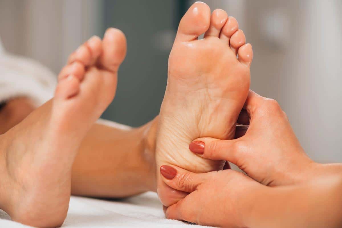 feet being massaged with a ladies hands