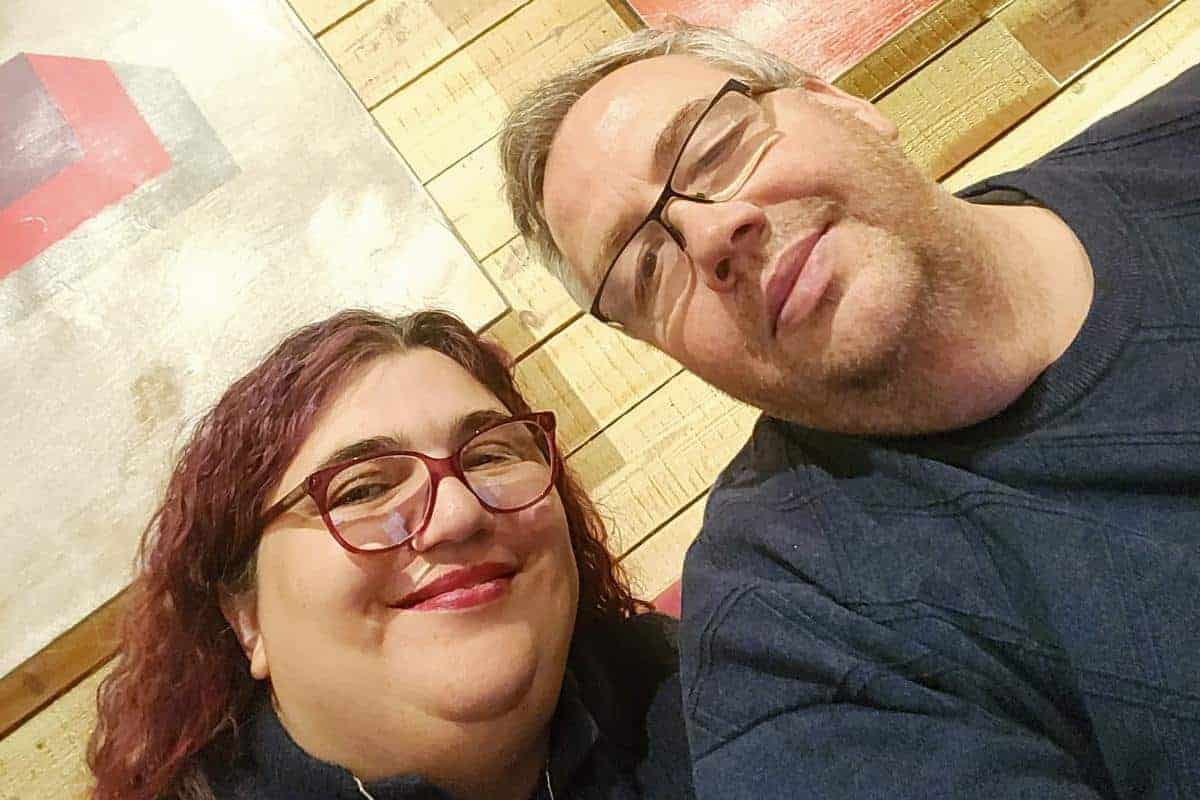 Jen and her partner Stuart smiling at the camera