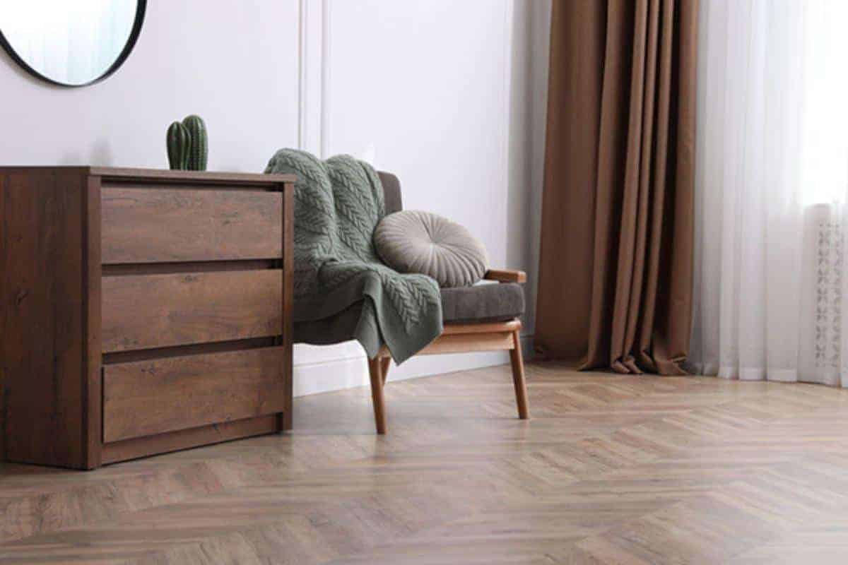 bedroom with herringbone flooring.