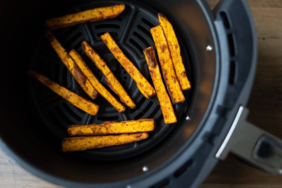 cooked sweet potato fries in an air fryer.