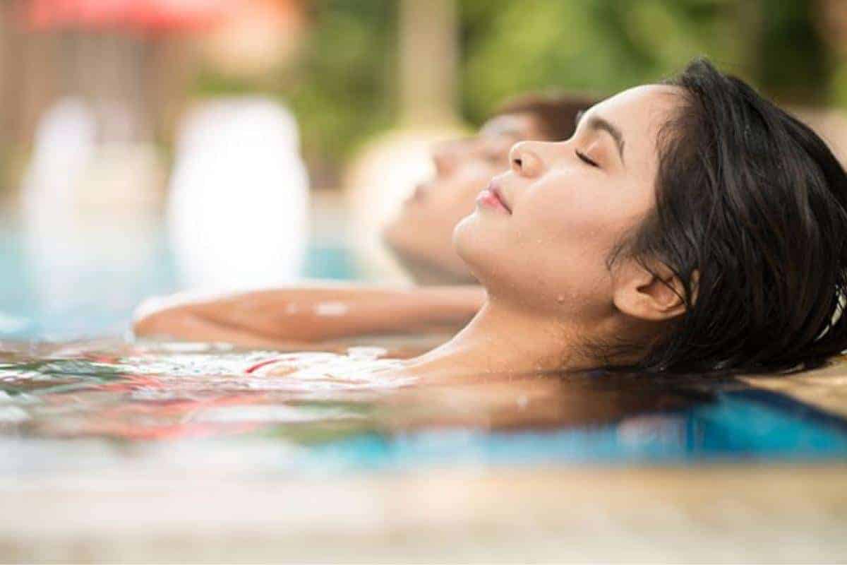 lady relaxing in a pool
