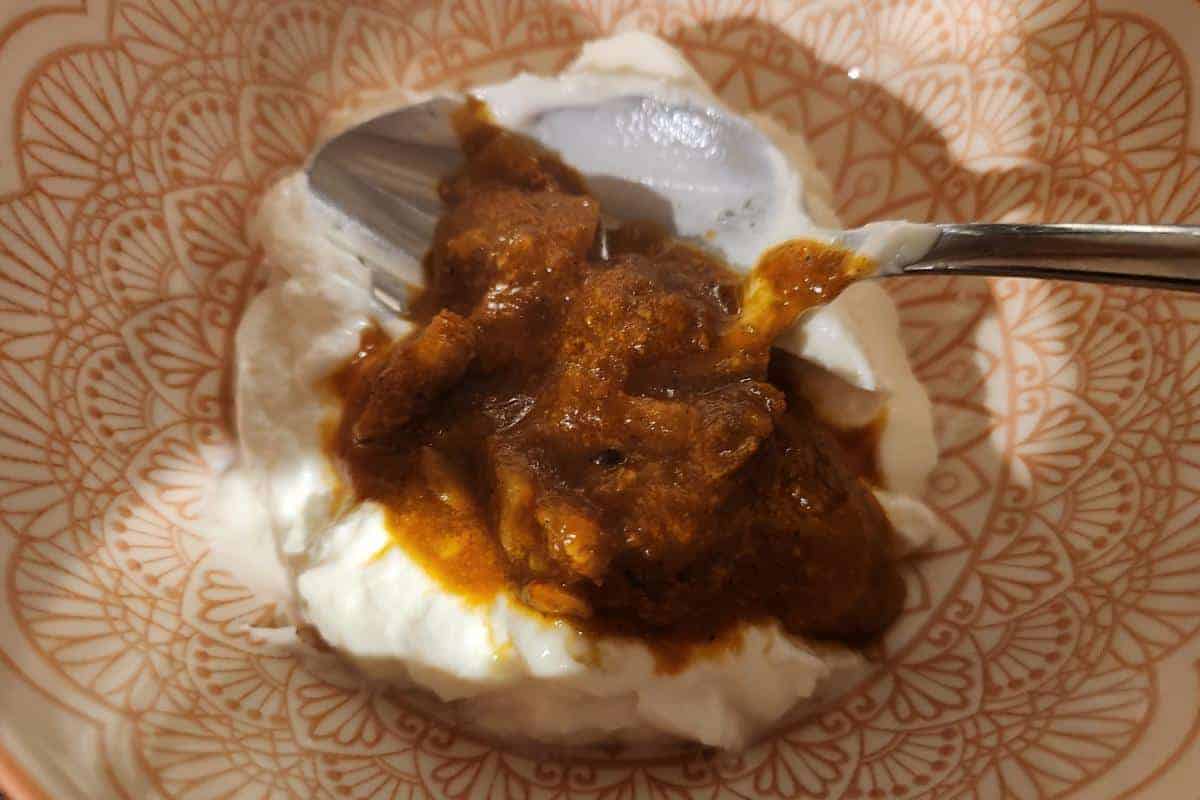 Miking tikka spices into yoghurt.