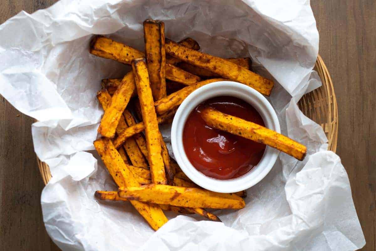 basket of sweet potato fries and ketchup dip