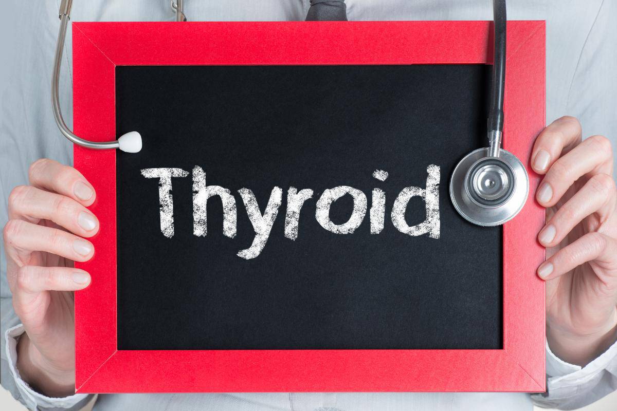 The word thyroid written on a chalk board with a stethoscope hanging over the board.