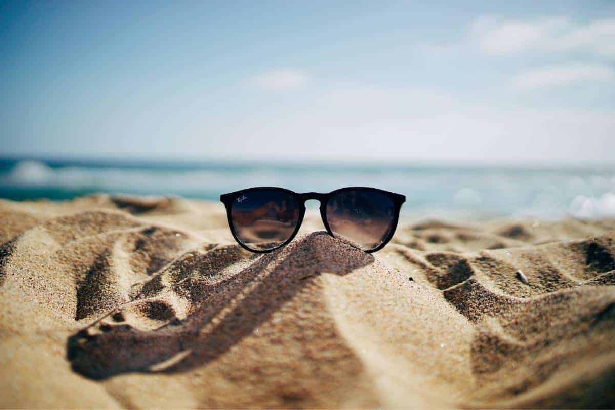 sunglasses in the sand.