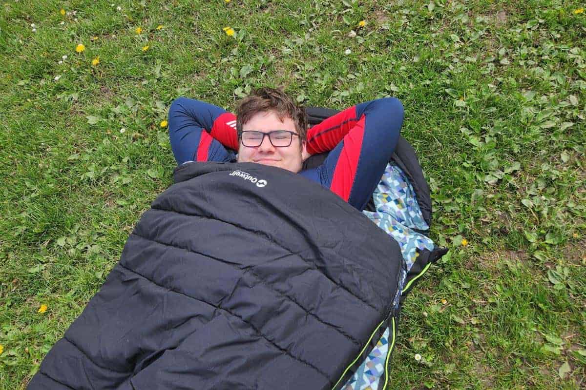 young man in a sleeping bag