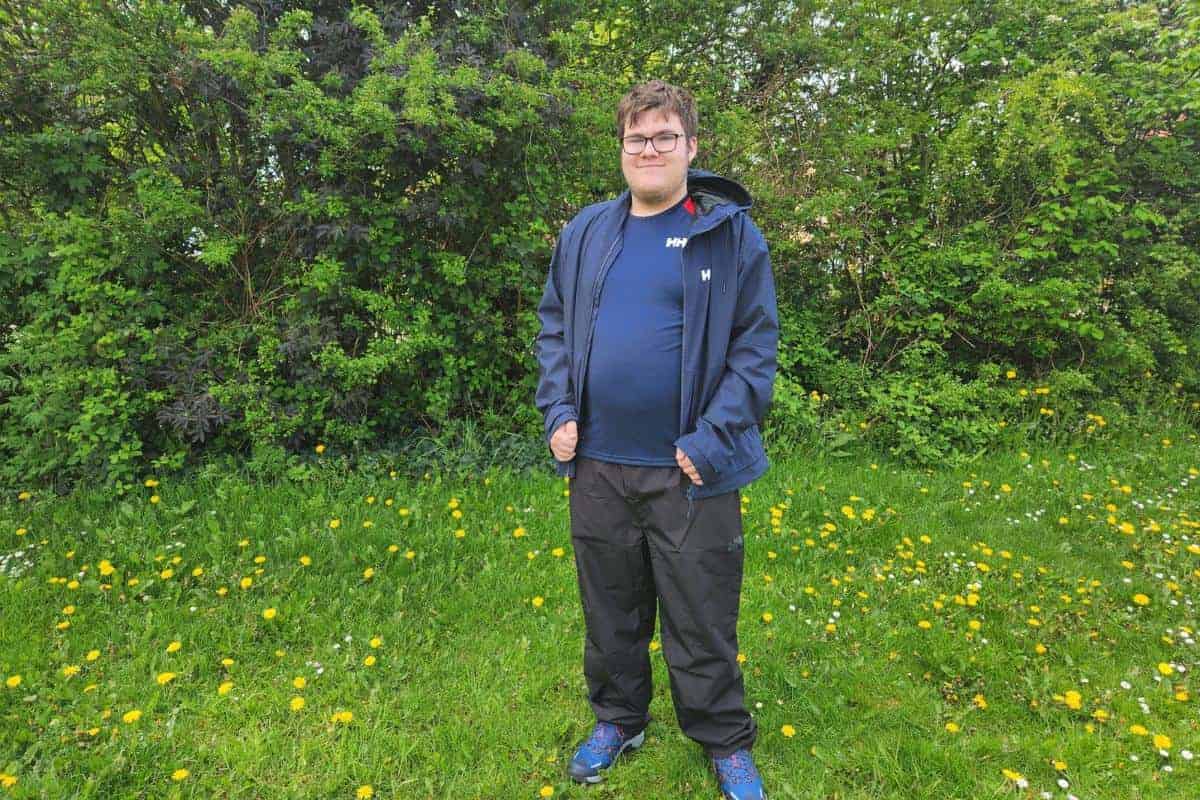 young man in Helly Hansen clothing outside
